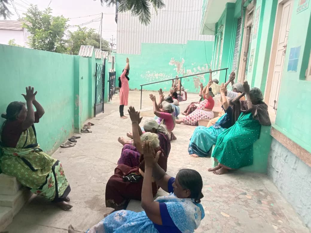 Residents gathered in the green courtyard of the home